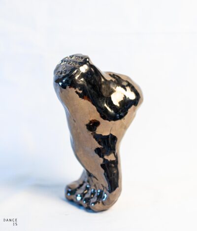 ceramic foot with motivation quote glazed with dark bronze