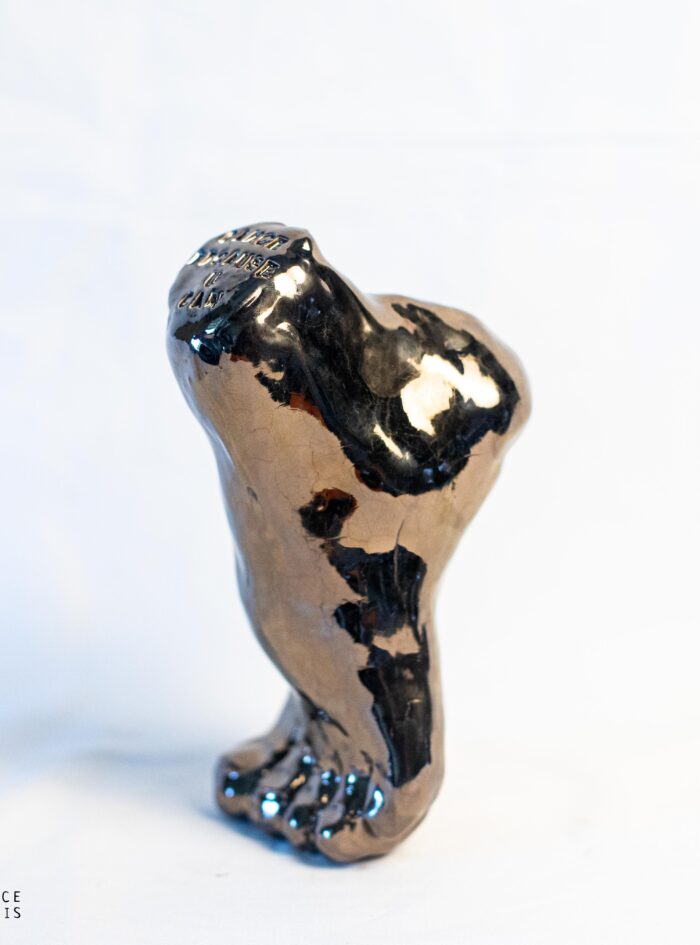 ceramic foot with motivation quote glazed with dark bronze
