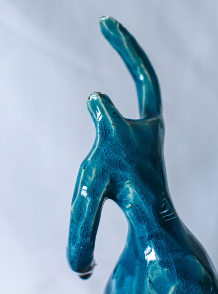 Handmade blue glazed ceramic ballerina sculpture with raised arms and flowing dress, presented in wooden gift box – Dance Is Ceramica