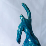 Handmade blue glazed ceramic ballerina sculpture with raised arms and flowing dress, presented in wooden gift box – Dance Is Ceramica