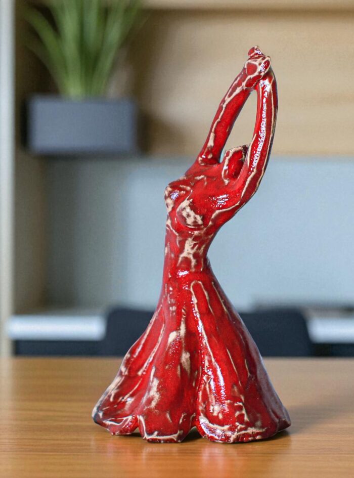 red dancer on a marble table -Photoroom (1)