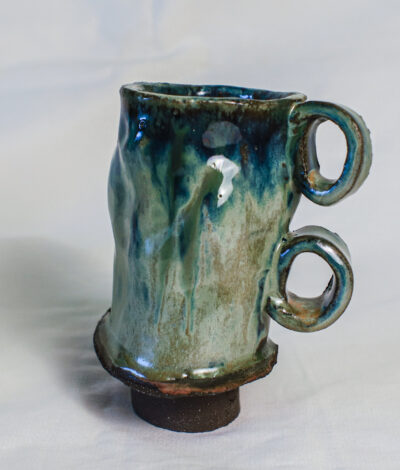 Handmade 300 ml ceramic beer mug with green-blue glaze and two sculptural loop handles