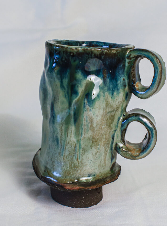 Handmade 300 ml ceramic beer mug with green-blue glaze and two sculptural loop handles